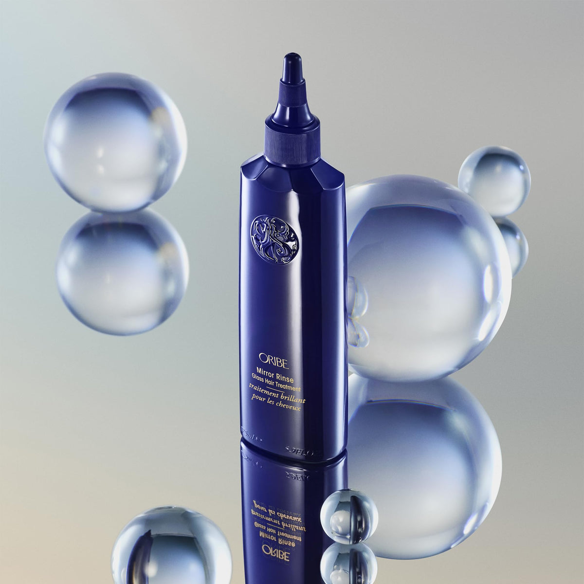 Oribe Mirror Rinse beside 5.9oz measure communicates true product size and scale