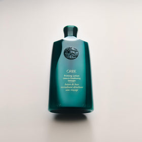 Oribe label close-up showing product claims and ingredient transparency benefit