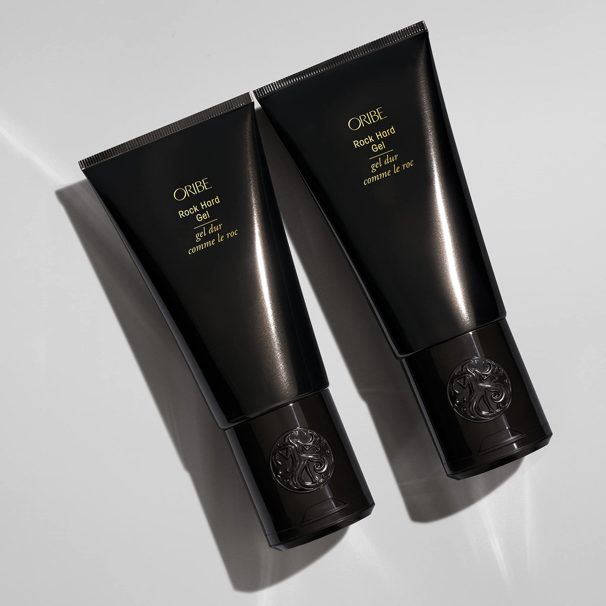 Oribe Rock Hard Gel in use creating spiked hairstyle with firm sculpted hold