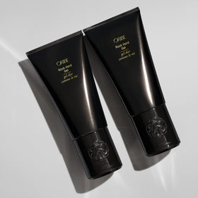 Oribe Rock Hard Gel in use creating spiked hairstyle with firm sculpted hold