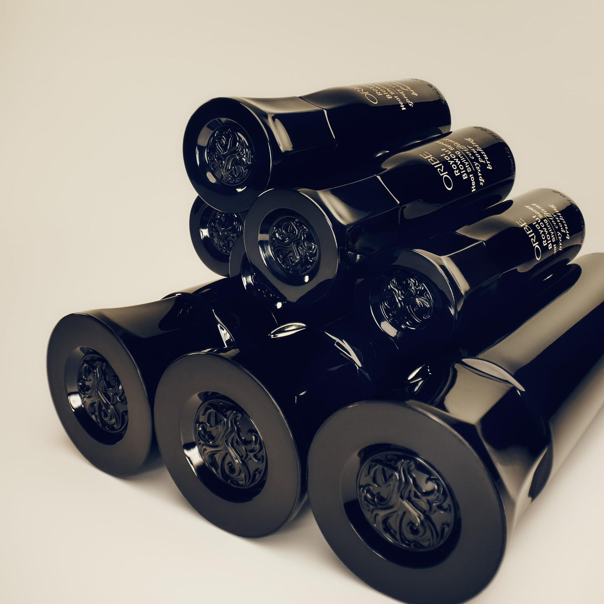 Applying Oribe Royal Blowout to damp hair for smoother, frizz-reduced blowouts