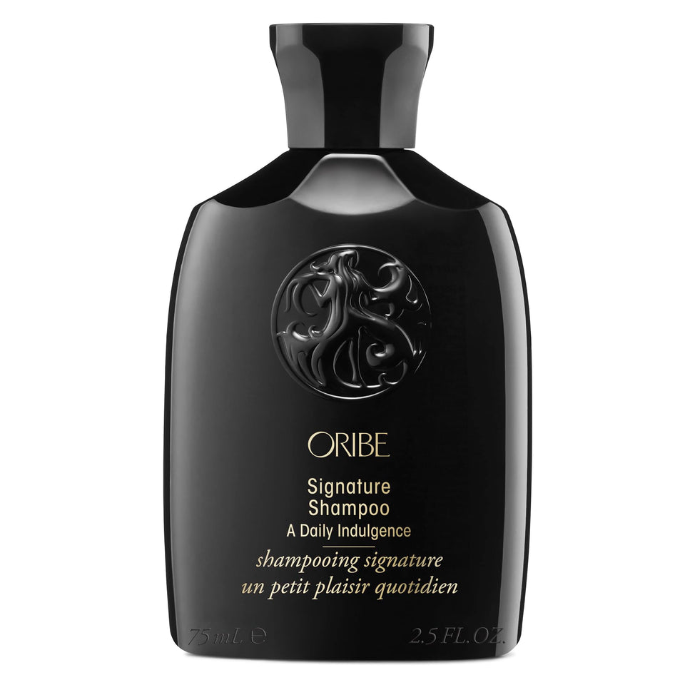 Oribe signature shampoo front bottle showing premium packaging and travel benefit