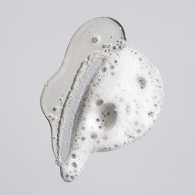 ORIBE pump top detail demonstrating easy-dispense packaging for controlled use