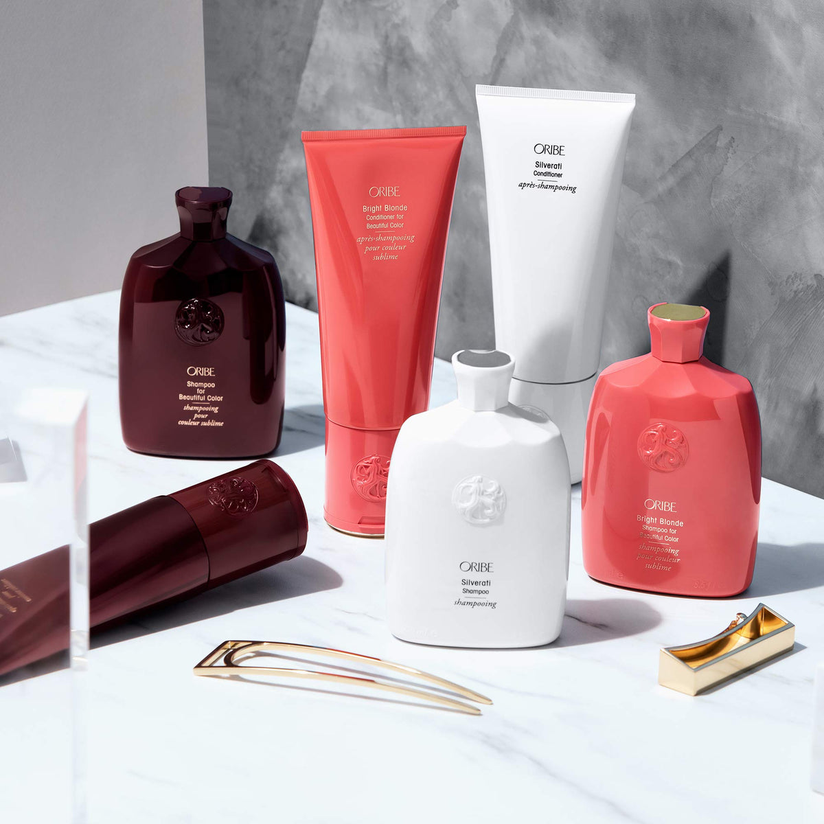 ORIBE Silverati being applied to silver hair in shower for smoother detangling