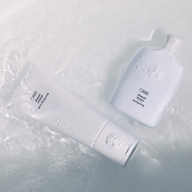 ORIBE Silverati conditioner cream texture close-up showing rich hydrating formula