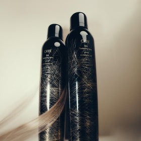 Oribe spray staged on vanity to show everyday styling routine convenience