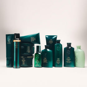 Oribe lifestyle shot of model with defined curls showcasing natural bounce