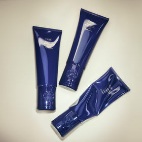 Oribe Supershine applied during styling demonstrating heat-protection benefit