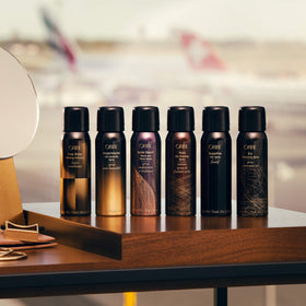 Close-up mist spray from Oribe Thick Dry Finishing Spray illustrating fine dry texture for volume
