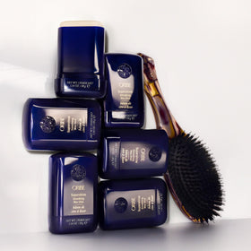 Côte d’Azur scent visual next to Oribe Supershine wax stick evoking fresh fragrance