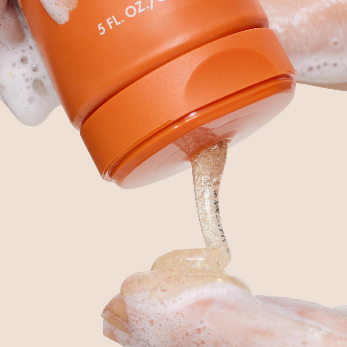 Origins GinZing jojoba beads detail highlighting gentle polishing action and refined pores