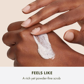 Origins hand showing scale next to products demonstrating compact travel-friendly size benefits