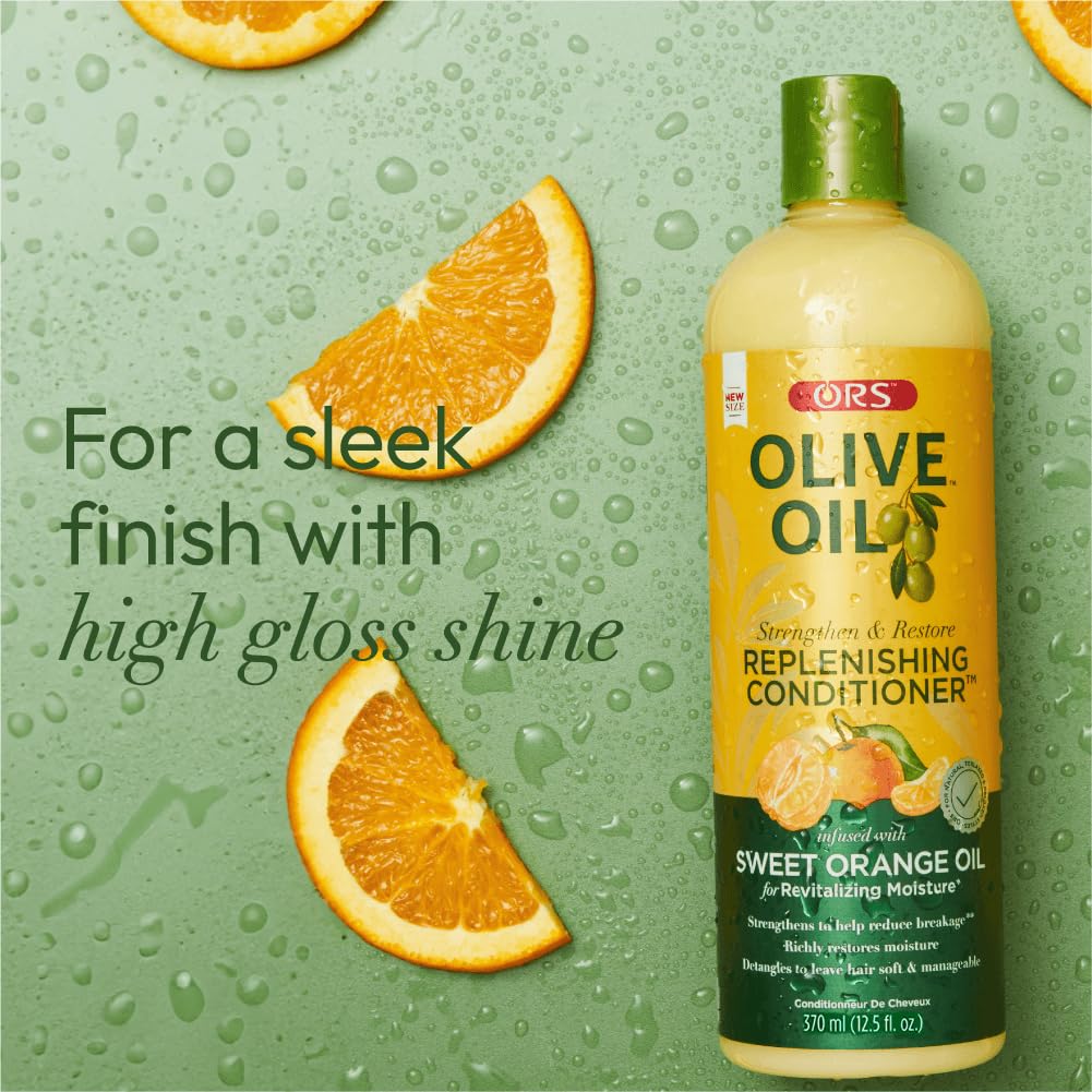 ORS conditioner applied on wet hair in hands demonstrating smooth detangling benefit