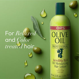 ORS application shot of lotion in hands smoothing through hair to detangle and protect before styling
