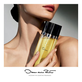 Oscar de la Renta bottle angled to show label and glass clarity for gifting appeal