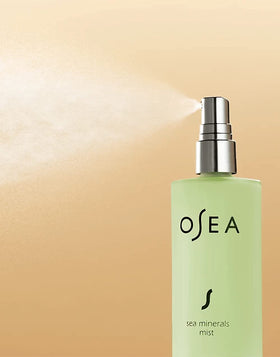 OSEA bottle in hand for scale, travel-friendly size and convenience benefit