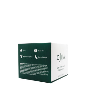 OSEA jar in a bath setting with towel and candle, evokes relaxing spa ritual