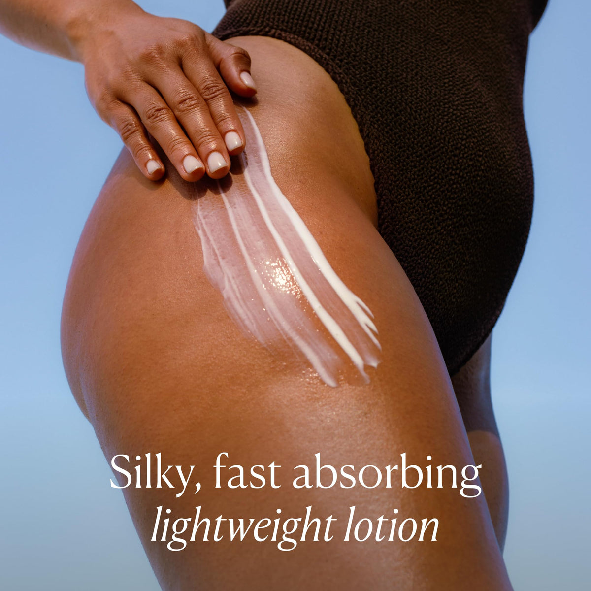 OSEA applying lotion on hand demonstrating fast-absorbing benefit