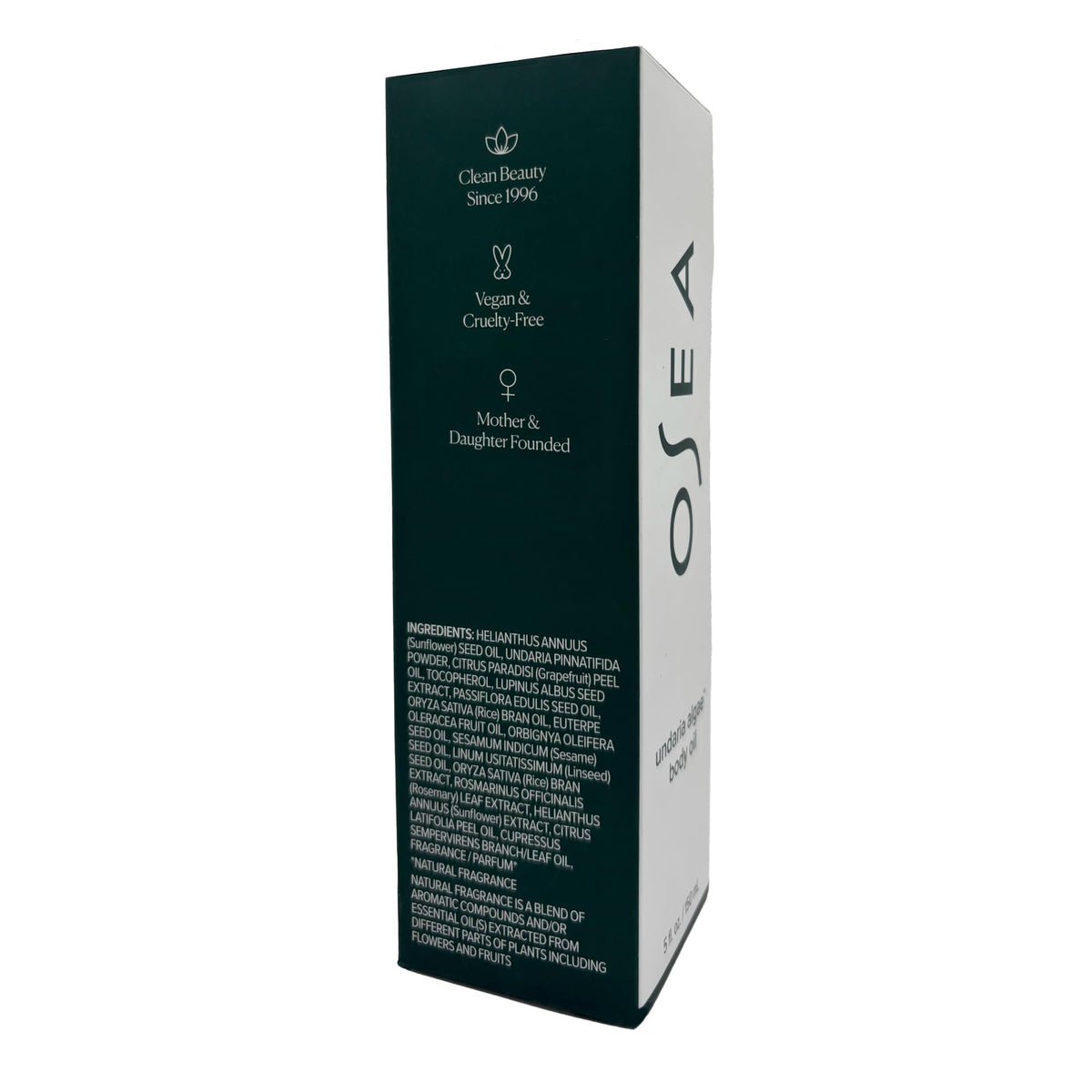 OSEA bottle in outdoor scene with citrus fruit hinting at uplifting scent benefit