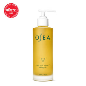OSEA oil dropper releasing clear oil, highlighting fast-absorbing hydration benefit