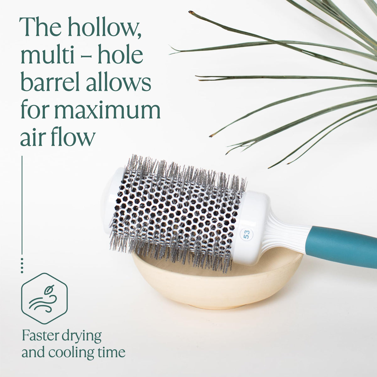 Osensia brush in use with blow dryer creating volume and smooth finish