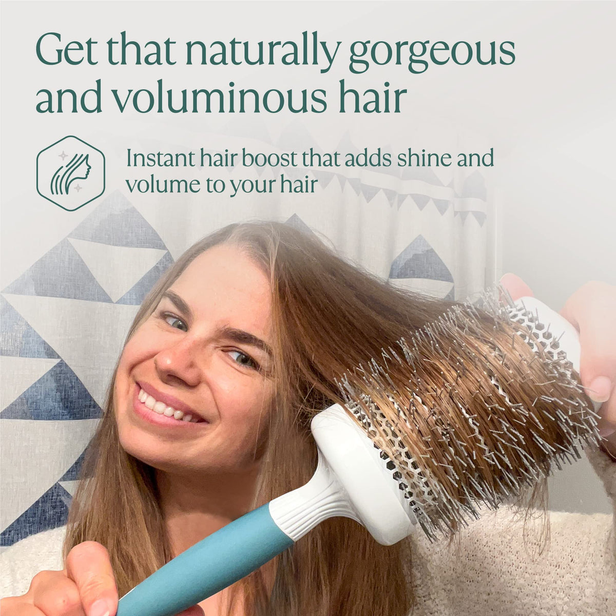 Osensia brush beside hand to show 2-inch barrel size for styling control