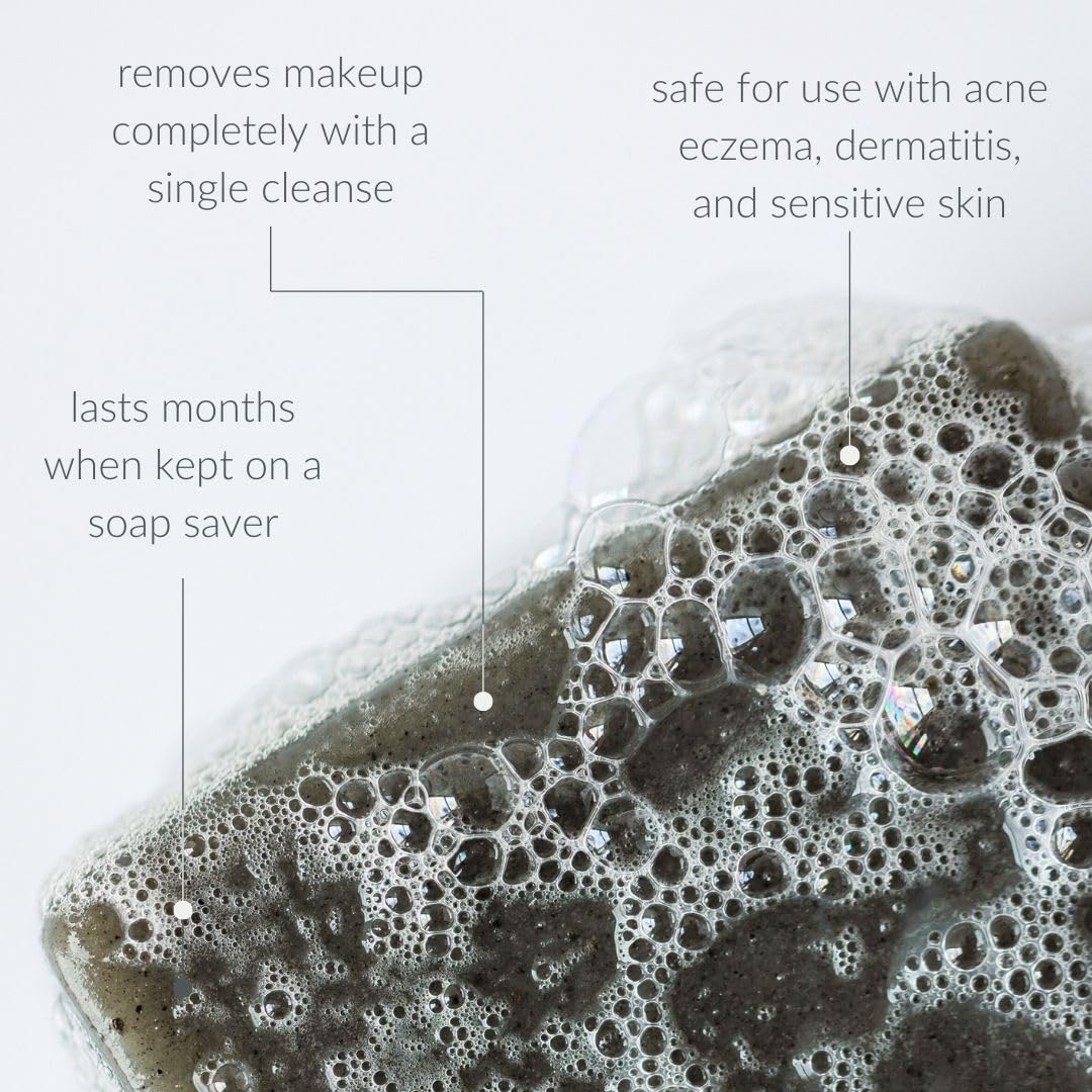 Osmia soap held in hand to show compact 2.25 oz size and travel convenience