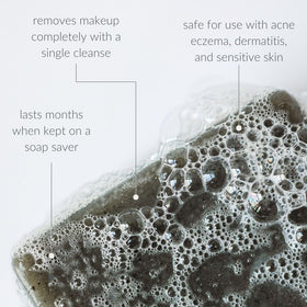 Osmia soap held in hand to show compact 2.25 oz size and travel convenience