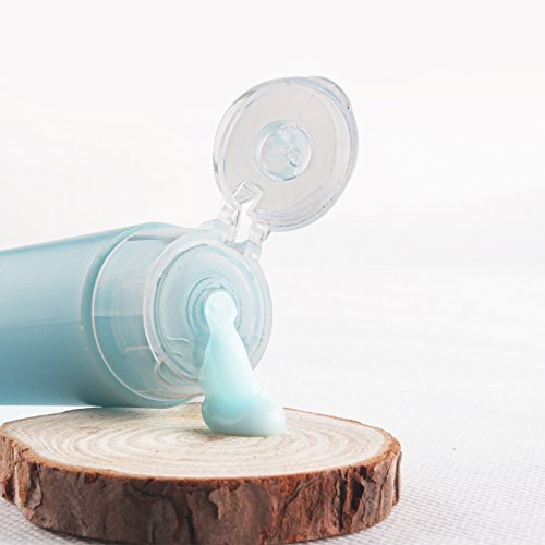 OTO bottle beside ruler showing 30ml scale for compliant travel size
