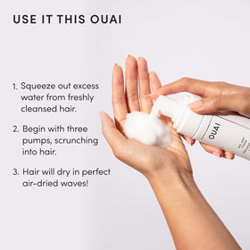 Close-up of OUAI label highlighting kale and carrot extracts