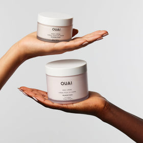 OUAI applying cream on arm demonstrating instant hydration and smoothing benefit