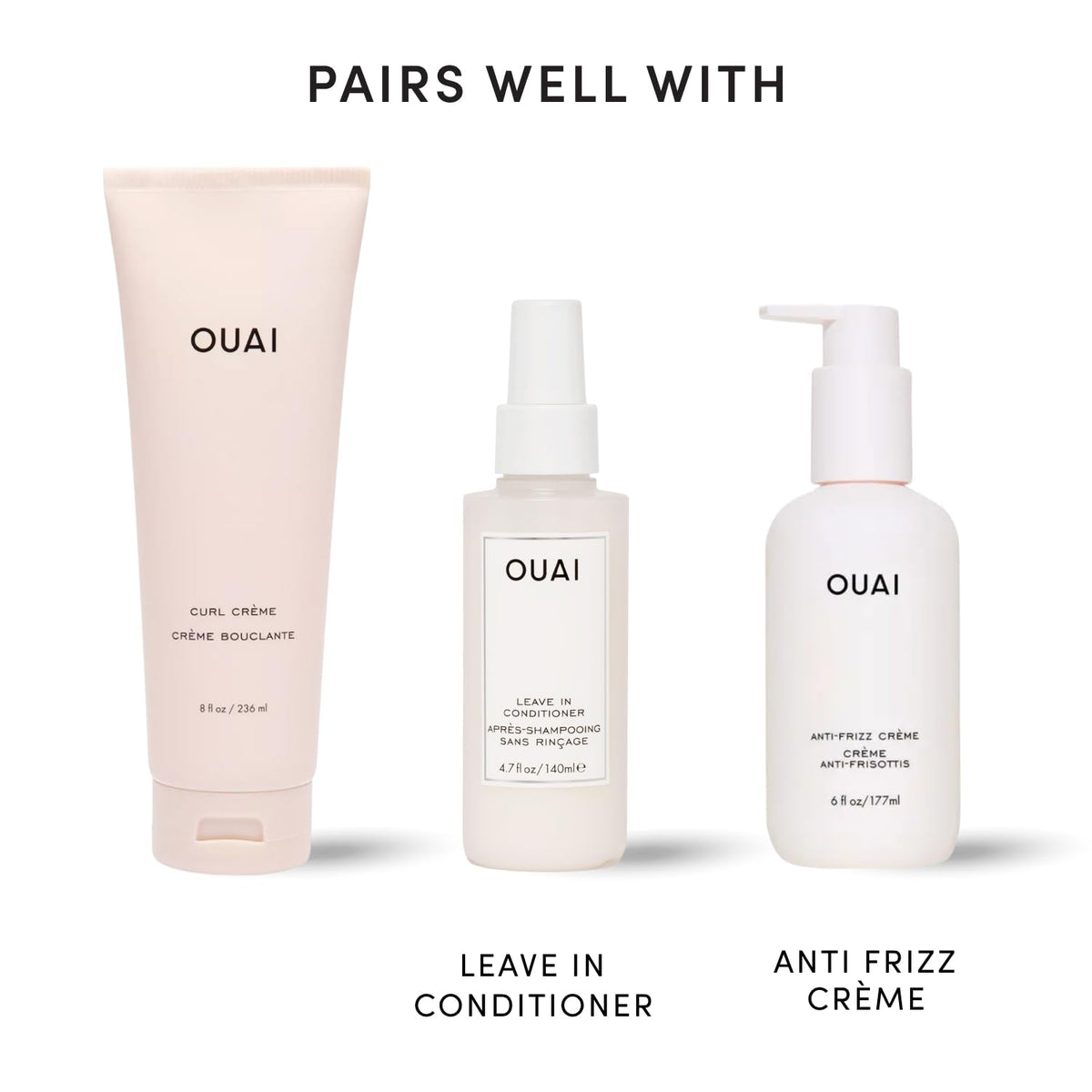 OUAI curl cream next to a hand for scale, easy-to-carry 8 oz size