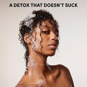 OUAI detox shampoo next to conditioner displaying complete hair care