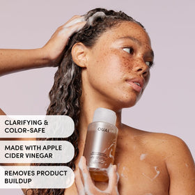 OUAI detox shampoo lather texture demonstrating effective cleansing