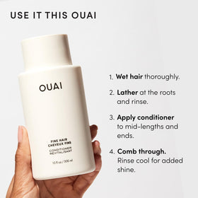 OUAI bathroom lifestyle shot of bottles on shelf signaling effortless styling