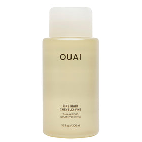 OUAI bottle front view showing clean design and volumizing promise