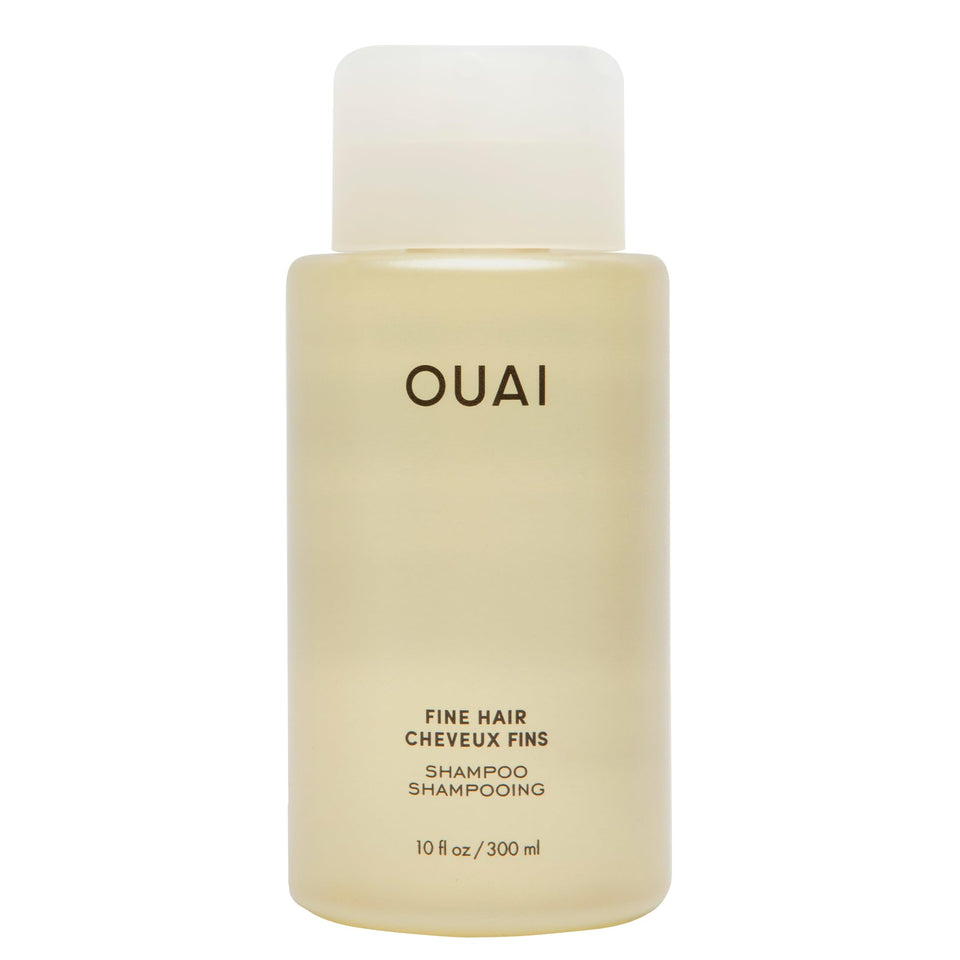 OUAI bottle front view showing clean design and volumizing promise