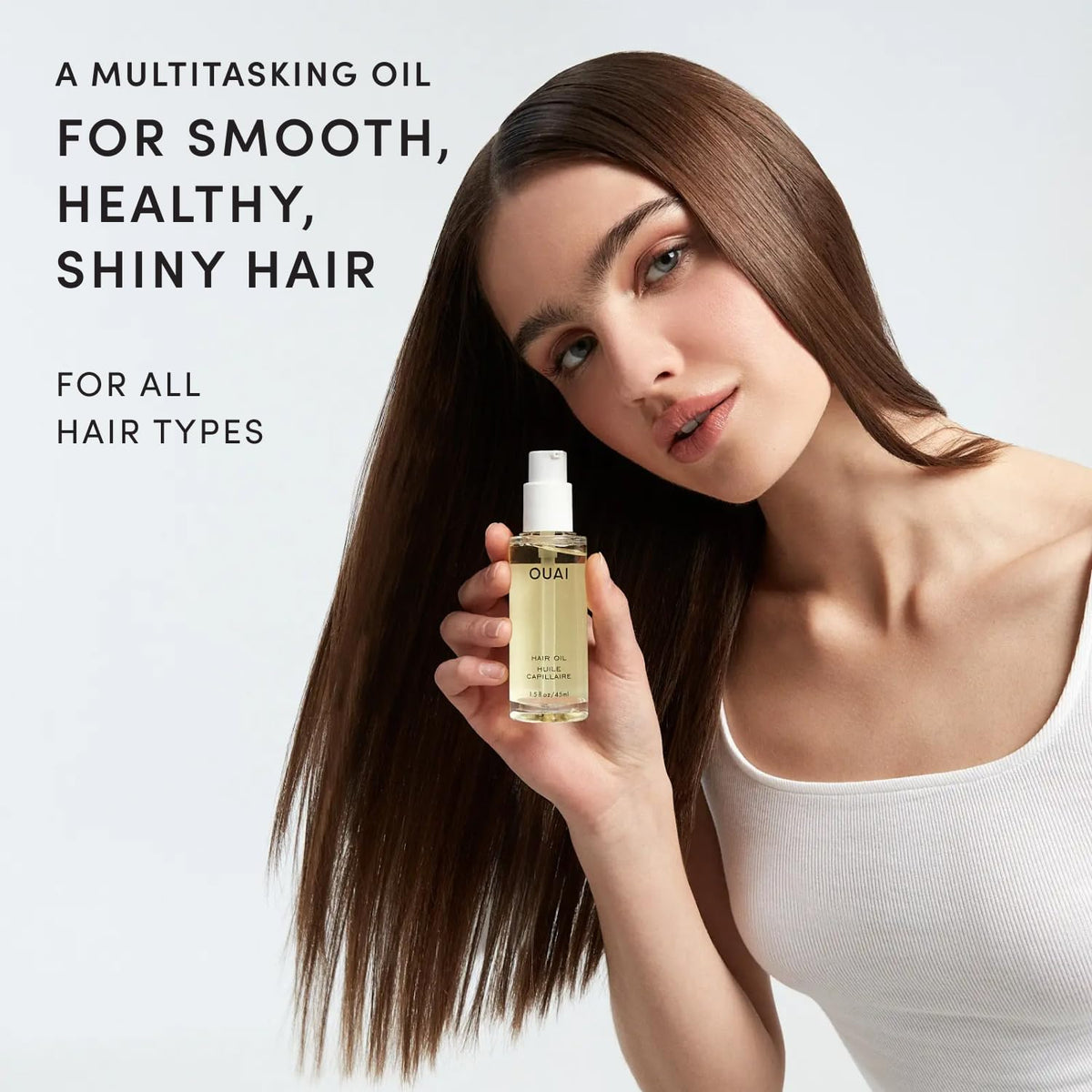 OUAI hair oil drop dispensing close-up demonstrating controlled application benefit