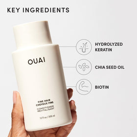 Close-up chia seed oil ingredient with OUAI branding emphasizing natural-thickening benefit