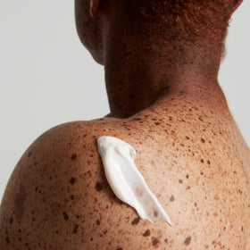 OUAI product label and ingredient list showing cupuaçu butter coconut oil squalane