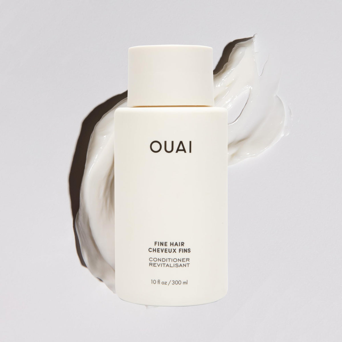 OUAI label close-up displaying product name and recyclable claim for clarity
