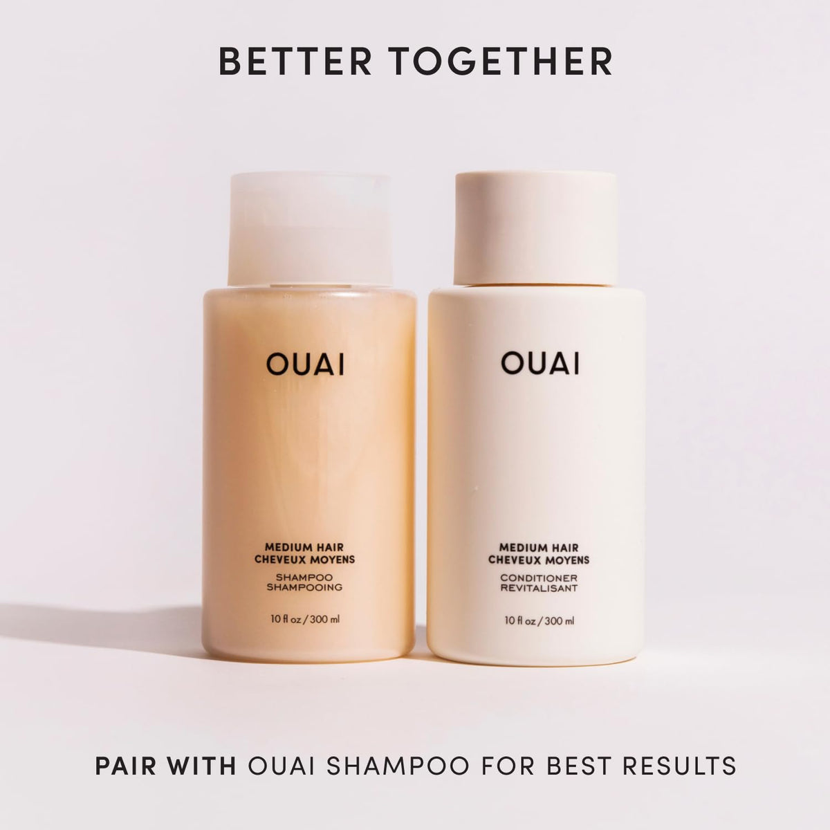 OUAI medium conditioner closeup on ingredients list emphasizing keratin and oils benefit