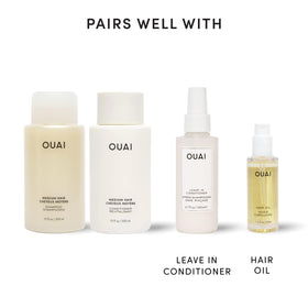 OUAI bottles styled on bathroom shelf, suggesting lifestyle ease and shelf appeal