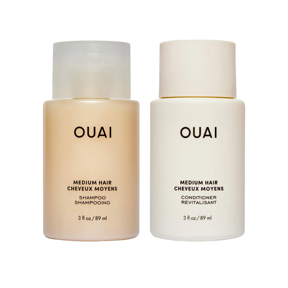 OUAI travel set front view showing shampoo and conditioner in compact bottles and easy packing benefit