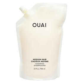 OUAI front bottle view showing labeled medium-hair shampoo and refill benefit