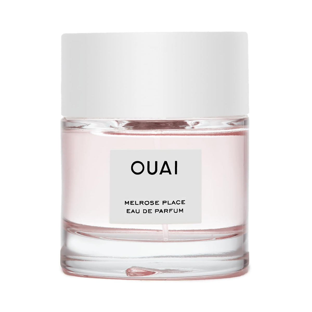 OUAI bottle front view showing elegant design and everyday wear benefit