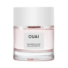 OUAI bottle front view showing elegant design and everyday wear benefit