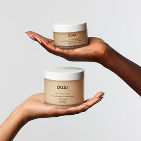 OUAI Melrose Place next to travel toiletry items to illustrate convenient 3.4 oz size