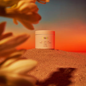 OUAI scrub massaged onto elbow, illustrates smoothing of rough skin