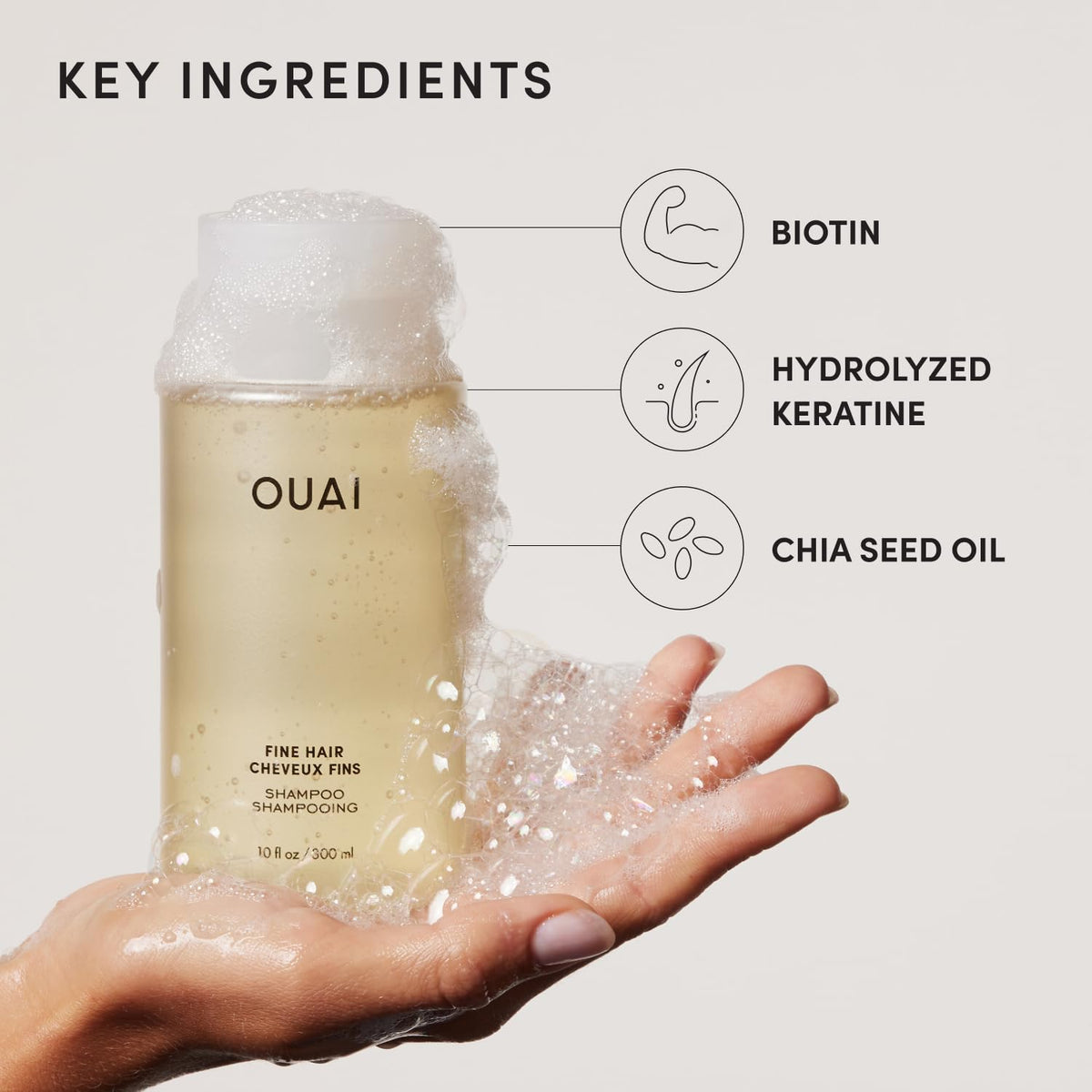 OUAI shampoo being poured into hand showing smooth texture and easy application